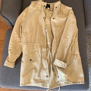 Tan hooded trench coat with cinched waist